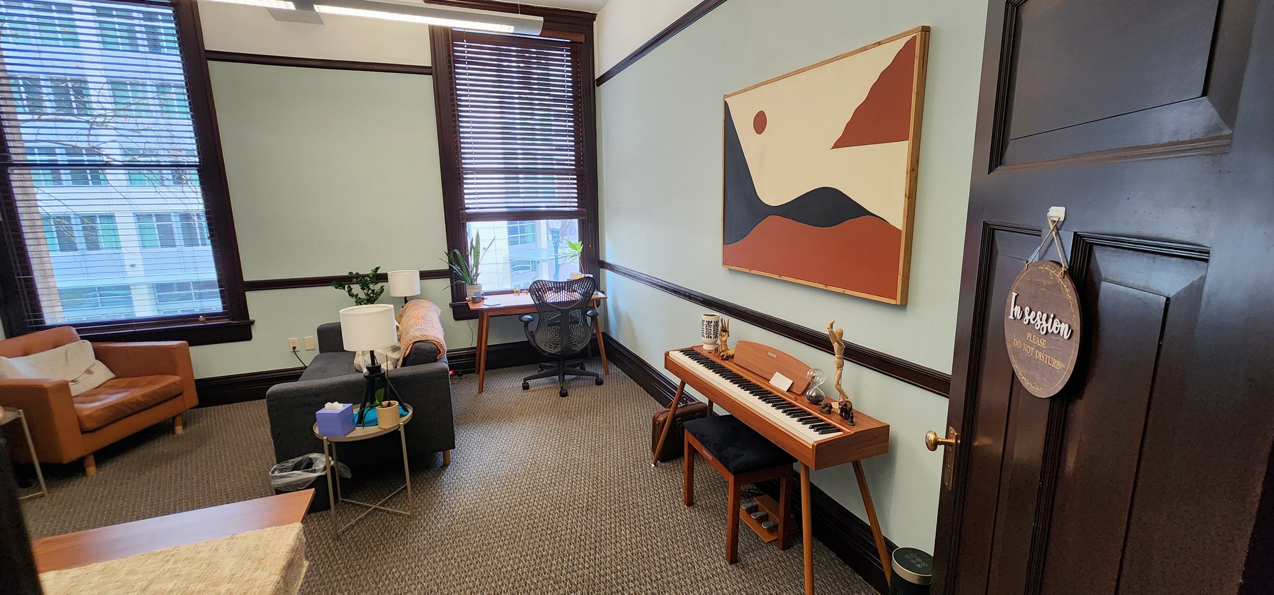 Therapy office with sofa and warm seating